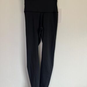 NWT yunoga Black high-waisted activewear leggings in a size XS.